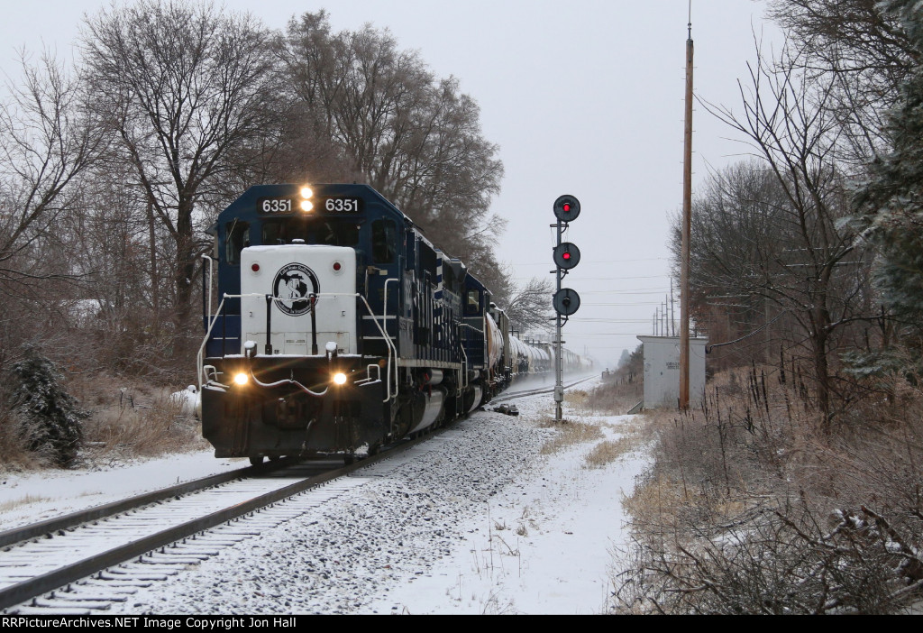 6351 & 6302 pick up speed as they roll downhill with Z127 past the south end of Clyde siding